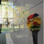 Oak Lawn Cemetery and Arboretum bouquet on granite crypt in community mausoleum