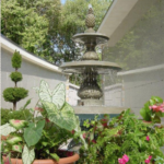 Oak Lawn Cemetery and Arboretum fountain and garden next to community mausoleum